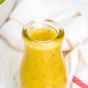 Homemade creamy dressing in a glass jar.