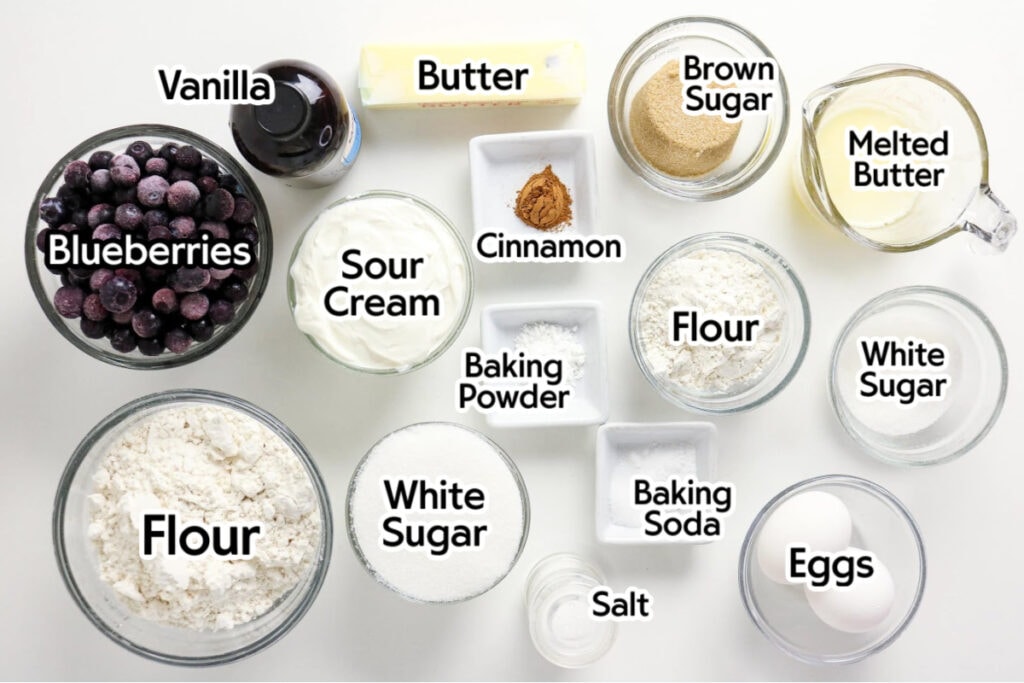 Ingredients needed to make the sour cream blueberry coffee cake recipe with text labels.