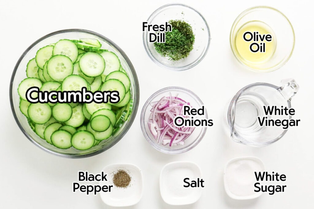 Ingredients needed to make cucumber salad with dill with text labels.