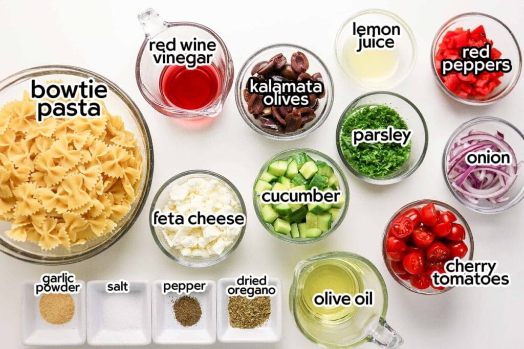 Ingredients needed to make the best Mediterranean pasta salad recipe with text labels.