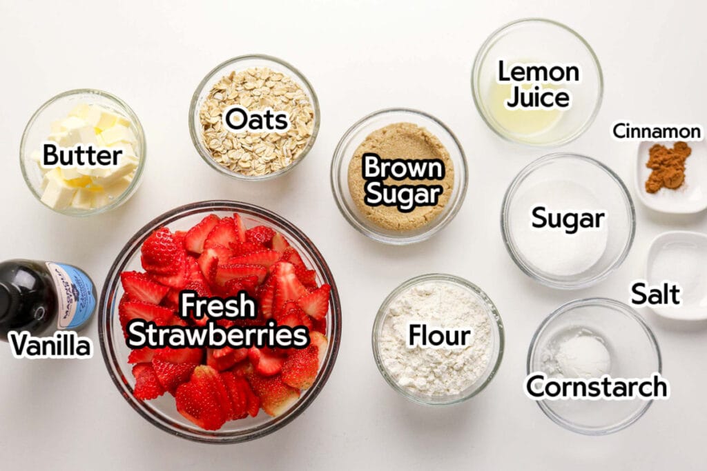 Ingredients needed to make homemade strawberry crumble recipe with text labels.