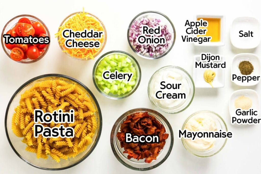 Ingredients needed to make the pasta salad with bacon recipe with text labels.