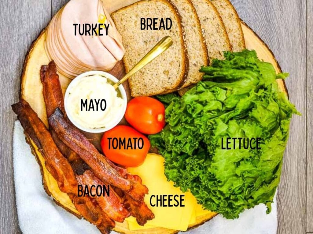 Ingredients to make turkey club sandwiches in the air fryer with text labels.