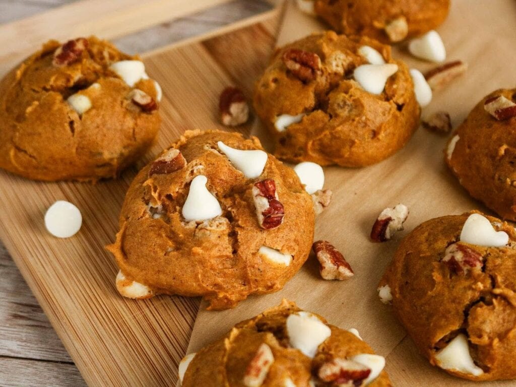 Pumpkin spice cookies made with cake mix on a wood board.
